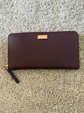 kate spade burgundy zip-around saffiano wallet with gold plaque